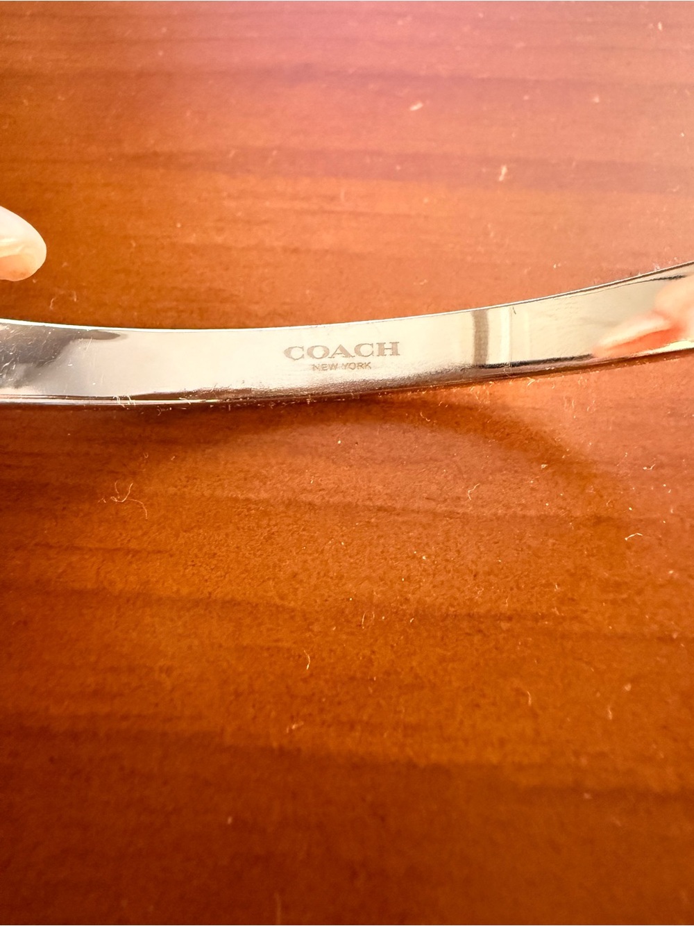 Coach Silver-Tone Logo Bangle with Crystal Accents - Picture 3 of 5